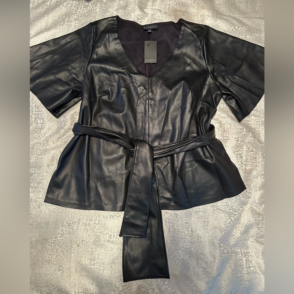 Never worn black faux leather shirt with belted waist size 18.